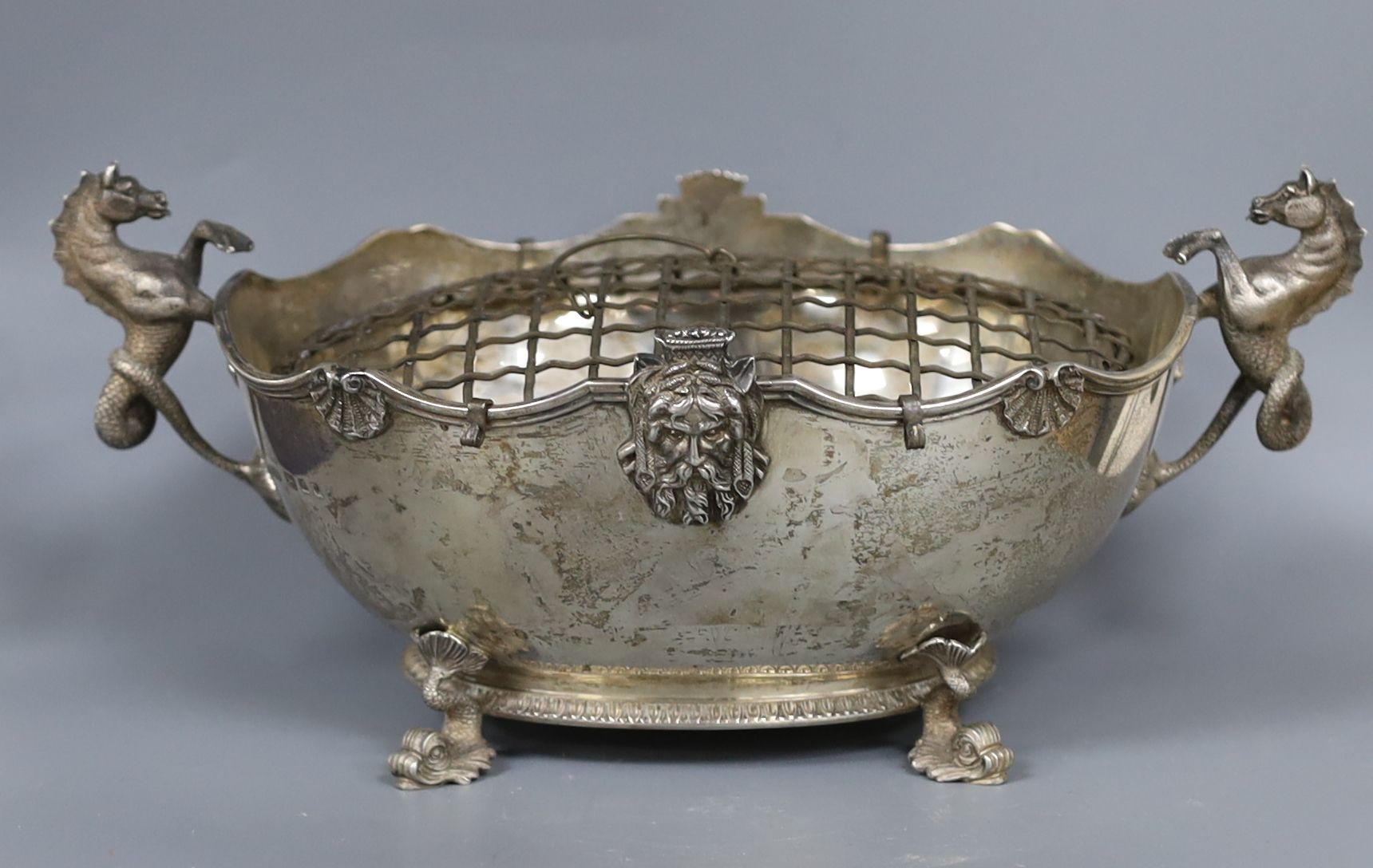 An ornate George V silver two handled oval rose bowl with sea horse handles and dolphin feet, Reid & Sons, London, 1926, 24cm over handles, 15oz.